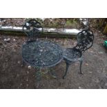 A PAINTED ALUMINIUM CIRCULAR GARDEN TABLE ( 60cm in diameter) and two chairs (3)