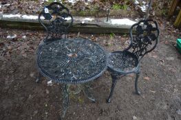 A PAINTED ALUMINIUM CIRCULAR GARDEN TABLE ( 60cm in diameter) and two chairs (3)