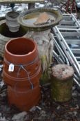 A TERRACOTTA CHIMNEY POT 65cm high, a Composite birdbath with three ladies forming the base and a