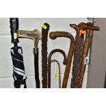 A BUNDLE OF SIX LATE VICTORIAN/20TH CENTURY WALKING STICKS/CANES, an umbrella and a teacher's