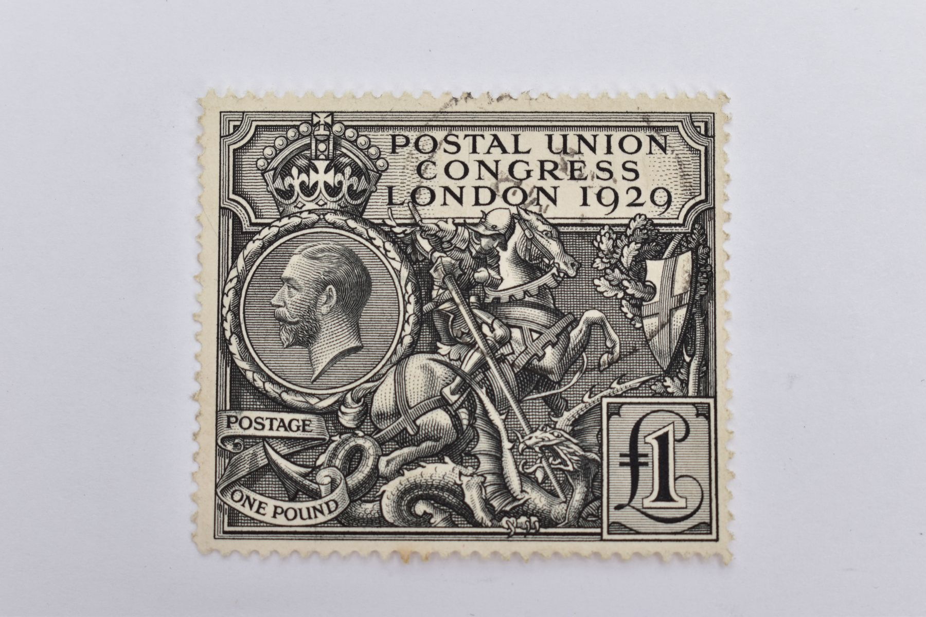 A 1929 'POSTAL UNION CONGRESS LONDON' ONE POUND POSTAL STAMP, depicting St. George and a dragon