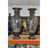 A PAIR OF JAPANESE FLOOR STANDING BALUSTER SHAPED VASES, polychrome enamel decoration depicting male