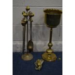 A BRASS FOUR PIECE COMPANION SET with ball and claw detail on a matching stand, together with a