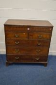 AN EARLY 20TH CENTURY OAK CHEST OF TWO OVER FOUR LONG DRAWERS, long secret frieze drawer, brass swan