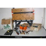 A BLACK AND DECKER WORKKMATE 750 and a box containing tools including a mitre block, mitre clamps,