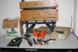 A BLACK AND DECKER WORKKMATE 750 and a box containing tools including a mitre block, mitre clamps,