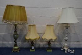 A BRASS AND ONYX FIGURAL TABLE LAMP, height 88cm, a pair of similar table lamps and a white