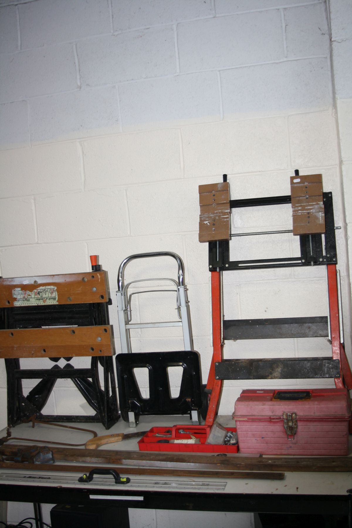 A BLACK AND DECKER WORKMATE, a Portable Workbench Vice, a plastic toolbox including tools, a folding