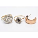 TWO 9CT GOLD RINGS AND A SINGLE HOOP EARRING, the first ring designed as a large cluster set with