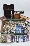 A BOX OF FLATWARE AND TWO WOODEN DISPLAY RACKS, to include a shoe box of collectable white metal