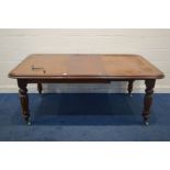 A REPRODUCTION VICTORIAN STYLE MAHOGANY WIND OUT DINING TABLE, two additional leaf, on bulbous