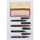 FOUR FOUNTAIN PENS, to include an emerald green and gold trim 'Parker', a black and gold trim '