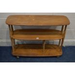 AN ERCOL MODEL 361 BLONDE ELM AND BEECH WINDSOR BOOKCASE TROLLEY, three tiers, the bottom tier