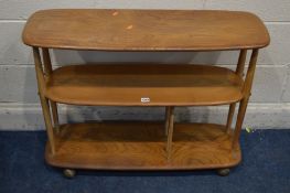 AN ERCOL MODEL 361 BLONDE ELM AND BEECH WINDSOR BOOKCASE TROLLEY, three tiers, the bottom tier