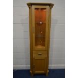 A MORRIS FURNITURE COMPANY, RANGE HORIZON, LIGHT OAK GLAZED SINGLE DOOR CORNER CUPBOARD, above a