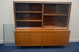 A HILLE INTERPLAN STYLE TEAK FOUR DOOR SIDEBOARD, with a matching glazed bookcase, width 187cm x