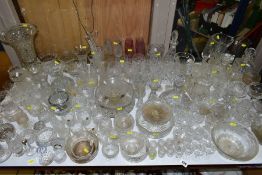 A QUANTITY OF GLASSWARE, including drinking glasses, bowls, jugs, decanters, rose bowls, vases,
