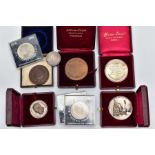 A SMALL PLASTIC BOX OF MEDALS AND COMMEMORATIVES, to include three white metal medals to Norbet
