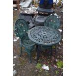 A PAINTED PLASTIC CIRCULAR GARDEN TABLE ( 68cm in diameter) and two chairs (3)