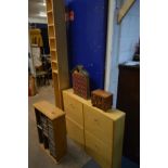 A MODERN BEECH FOUR DOOR SHOE CABINET, along with a tall slim cd rack, a pine cd rack, a wooden