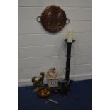 A CIRCULAR COPPER PLAQUE, diameter 45cm, along with a pair of brass door stops of a hound, resin