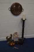 A CIRCULAR COPPER PLAQUE, diameter 45cm, along with a pair of brass door stops of a hound, resin