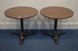 A PAIR OF CIRCULAR COPPER TOPPED LAMP TABLES, on a cast iron base, diameter 55cm x height 49cm (2)