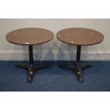 A PAIR OF CIRCULAR COPPER TOPPED LAMP TABLES, on a cast iron base, diameter 55cm x height 49cm (2)