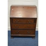 AN EDWARDIAN MAHOGANY BUREAU with a fitted interior three exterior drawers on bracket feet width