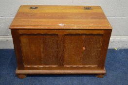 AN OAK PANELLED BLANKET CHEST, on bun feet, width 79cm x depth 44cm x height 52cm