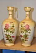 A PAIR OF WILTSHAW & ROBINSON (LTD) CARLTON WORKS IVORY GROUND BALUSTER VASES, printed and painted