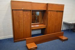 AN AUSTIN SUITE TEAK THREE PIECE ADJOINED BEDROOM FITMENT, comprising two sliding door wardrobes,