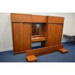 AN AUSTIN SUITE TEAK THREE PIECE ADJOINED BEDROOM FITMENT, comprising two sliding door wardrobes,