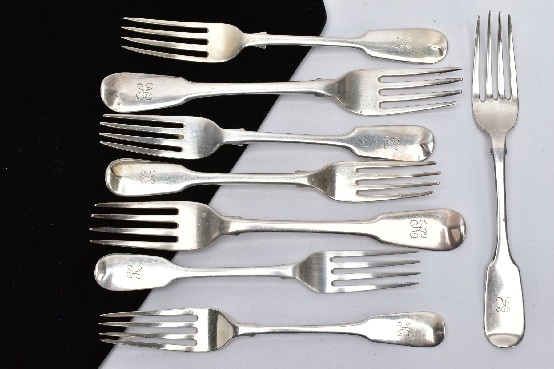 A QUANTITY OF SILVER FIDDLE PATTERN FORKS, each with an engraved initial 'K' to the handles, each