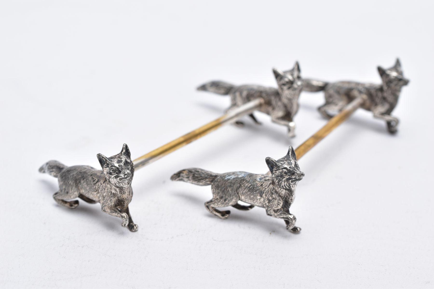 A PAIR OF WHITE METAL KNIFE RESTS, each rest modelled with two foxes to each end with a worn gilt - Image 3 of 5