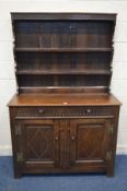 A 20TH CENTURY OAK DRESSER, with two drawers and double panelled doors, width 122cm x depth 45cm x