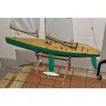 A REMOTE CONTROL POND YACHT OF PLASTIC CONTRUCTION WITH ALUMINIUM MAST, height including mast and