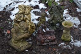 SIX COMPOSITE GARDEN FIGURES including twins on a bench 50cm high (6)