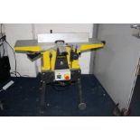 A PERFORM CCNPT PLANER THICKNESS 240volt with a 10 inch blade width, 103cm long bed, adjustable