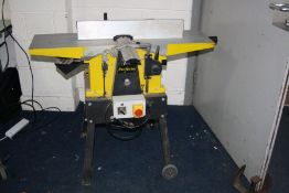 A PERFORM CCNPT PLANER THICKNESS 240volt with a 10 inch blade width, 103cm long bed, adjustable