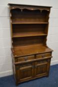 AN OLD CHARM OAK LINENFOLD DRESSER, with two drawers, width 93cm x depth 44cm x height 176cm