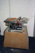 A CLARKE 10 INCH TABLE SAW mounted to a bespoke plywood stand (PAT pass and working) blade guard