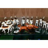 BESWICK FOXES AND FOXHOUNDS, comprising two foxes No 1440 (leg reglued on one), two foxhounds No 941