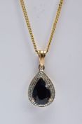 A 9CT GOLD SAPPHIRE AND DIAMOND PENDANT NECKLET, the pendant of a tear-drop shape, set with a pear