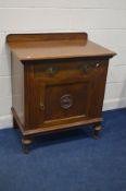 AN EARLY 20TH CENTURY OAK CUPBOARD, with a raised back, with a single drawer above a single