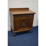 AN EARLY 20TH CENTURY OAK CUPBOARD, with a raised back, with a single drawer above a single