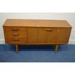 A MID TO LATE 20TH CENTURY TEAK SIDEBOARD, two cupboard doors, flanked by three drawers, width 144cm