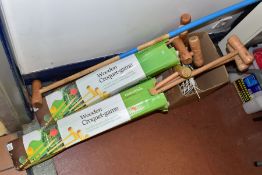 TWO MODERN PART BOXED CROQUET SETS, both sets well used, one set with homemade handle extensions