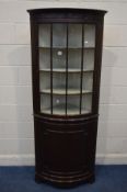 A MODERN MAHOGANY BOWFRONT FLOOR STANDING CORNER CUPBOARD width 74cm x depth 50cm x height 183cm (