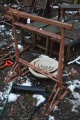 A PAIR OF BUILDERS TRESTLES, a broken water feature and a repro cast iron water pump ( 3)